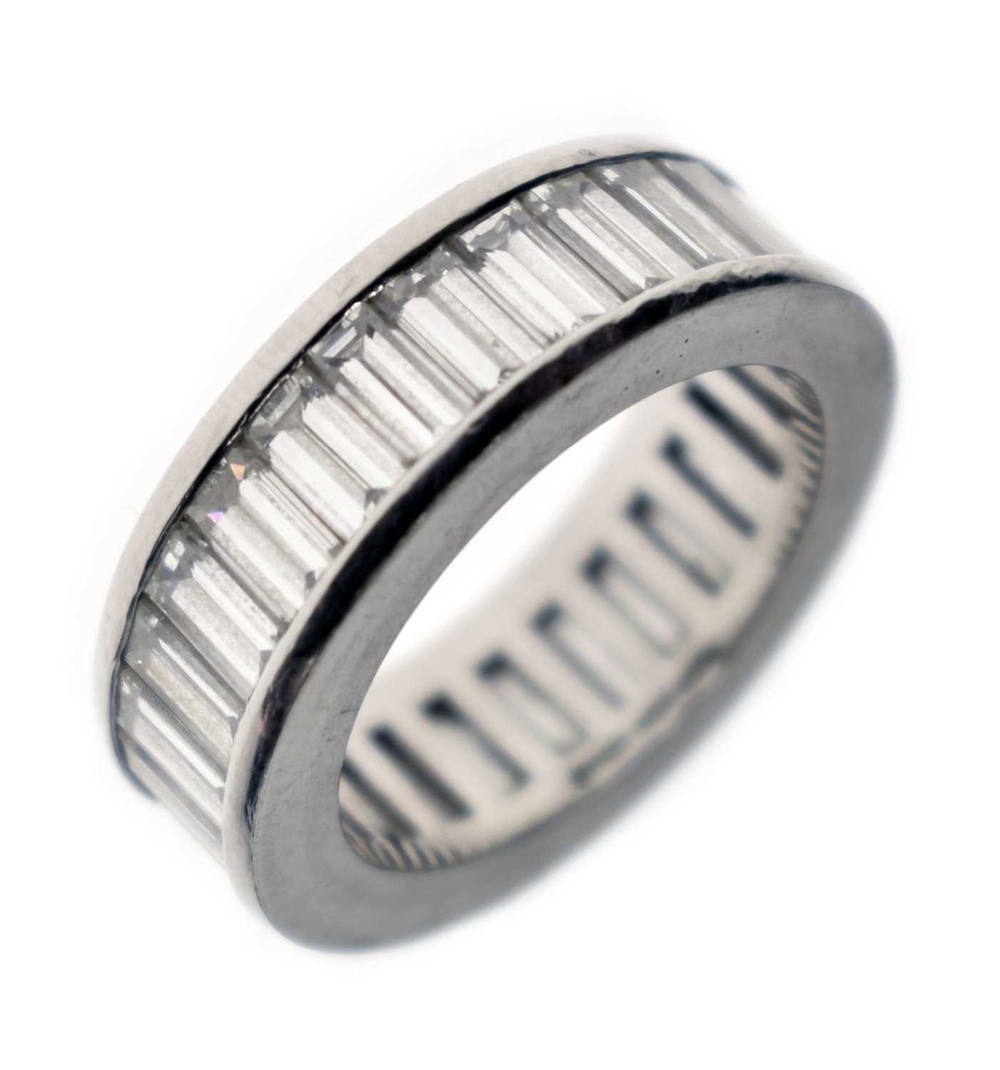 Lot 13 - Baguette cut diamond platinum eternity ring
