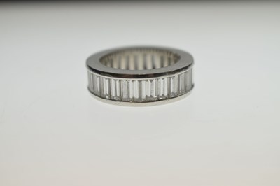 Lot 13 - Baguette cut diamond platinum eternity ring