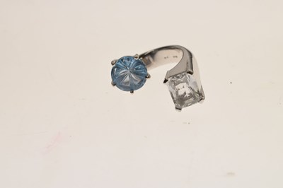 Lot 32 - White sapphire and blue topaz white metal 'toi et moi' style ring