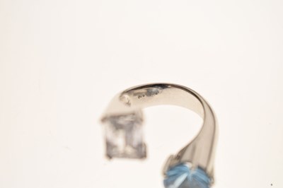 Lot 32 - White sapphire and blue topaz white metal 'toi et moi' style ring