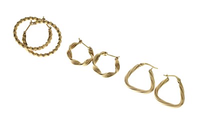 Lot 180 - Three pairs of 9ct gold hoop earrings (3)