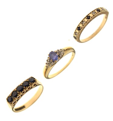 Lot 31 - Three gem set rings comprising a tanzanite and diamond 9ct gold dress ring, etc
