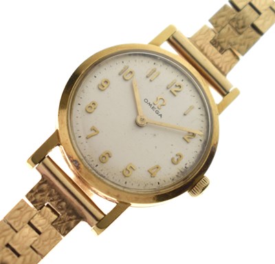 Lot 128 - Omega - Lady’s 18ct gold cased watch on 9ct bracelet, ref. 511.007