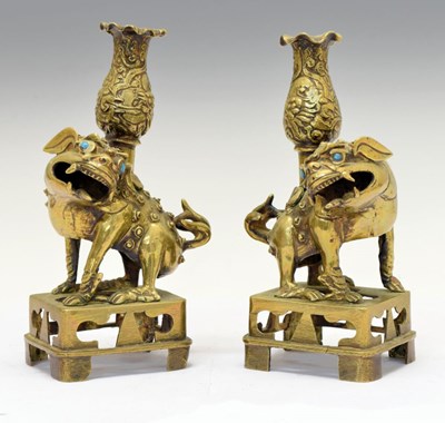 Lot 355 - Pair of Chinese or Tibetan bronze Dog of Fo candlesticks