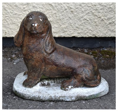 Lot 823 - Composition stone Dachshund garden ornament