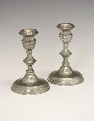 Lot 166 - Pair of 20th century white metal low candlesticks