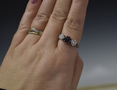 Lot 18 - Sapphire and diamond three stone 18ct white gold ring