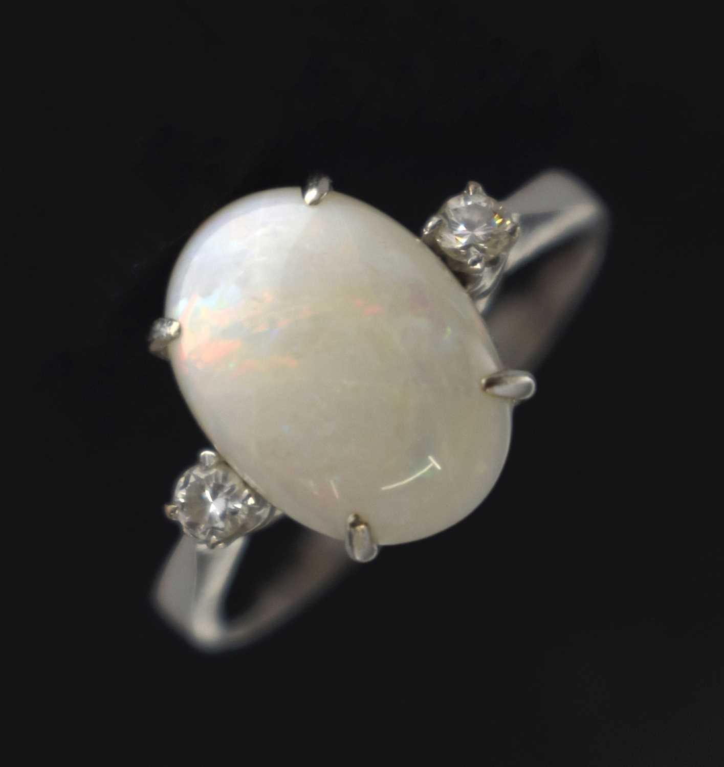 Lot 27 - Opal and diamond white metal dress ring