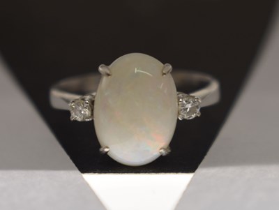 Lot 27 - Opal and diamond white metal dress ring