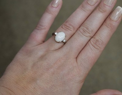Lot 27 - Opal and diamond white metal dress ring