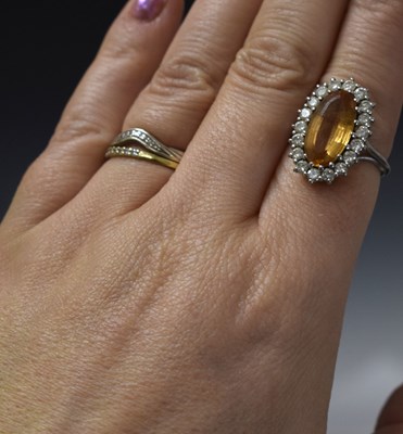 Lot 30 - Imperial topaz and diamond 18ct white gold cluster ring