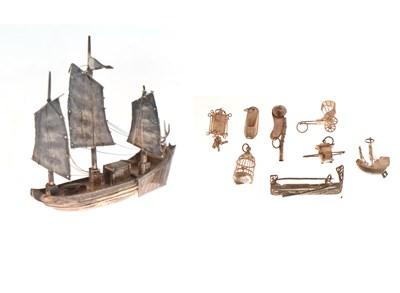 Lot 293 - Collection of white metal charms, etc