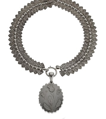 Lot 74 - Antique white metal articulated book chain necklace with a silver locket, Scottish thistles
