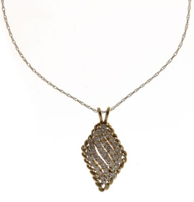 Lot 102 - Diamond multi-stone yellow metal pendant