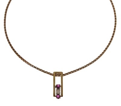 Lot 98 - Ruby and diamond three-stone 9ct gold pendant necklace