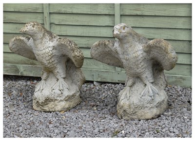 Lot 827 - A pair of composition stone eagles