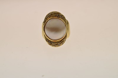 Lot 34 - Mabe pearl and diamond yellow metal ring