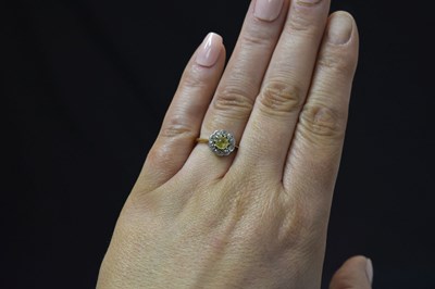 Lot 28 - Early 20th century yellow sapphire and diamond 18ct yellow gold cluster ring