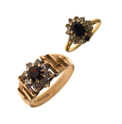 Lot 182 - Garnet and cubic zirconia 9ct gold cluster ring, and a sapphire and cubic zirconia cluster ring (2)