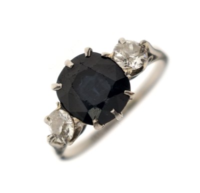 Lot 36 - Sapphire and diamond three-stone white metal ring