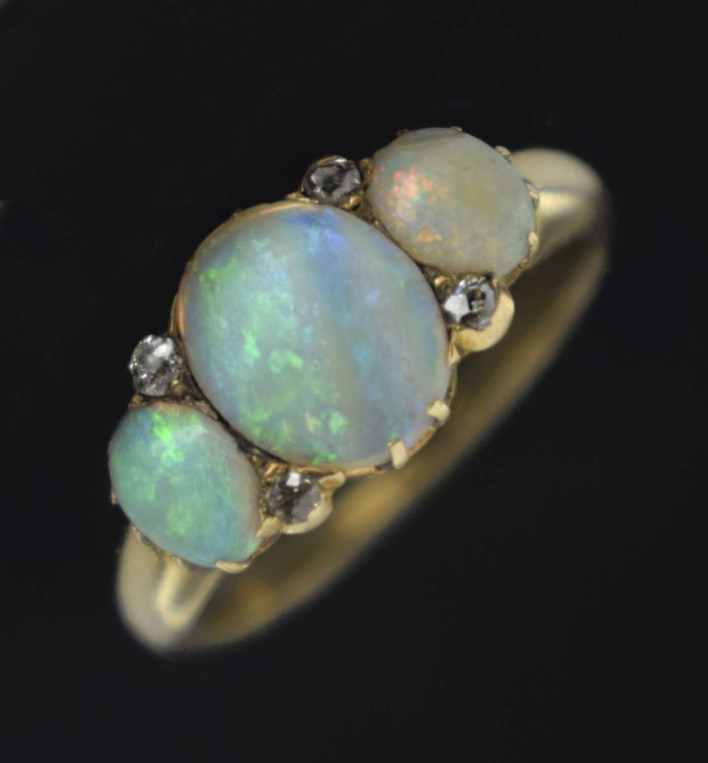 Lot 35 - Opal three stone unmarked yellow metal ring