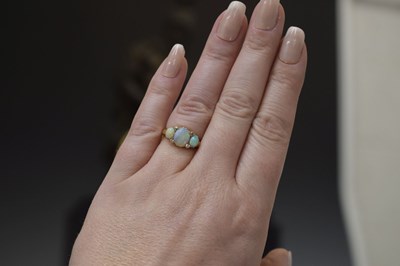 Lot 35 - Opal three stone unmarked yellow metal ring