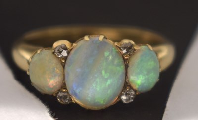 Lot 35 - Opal three stone unmarked yellow metal ring