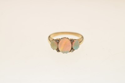 Lot 35 - Opal three stone unmarked yellow metal ring