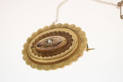 Lot 46 - Victorian diamond yellow metal oval target brooch