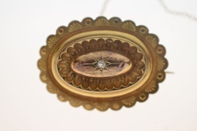 Lot 46 - Victorian diamond yellow metal oval target brooch