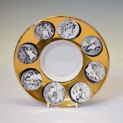 Lot 586 - Fornasetti Italian shallow dish decorated with classical figures on a gilt ground