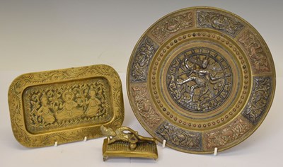 Lot 646 - Two Indian brass dishes and an Indian fakir figure (3)