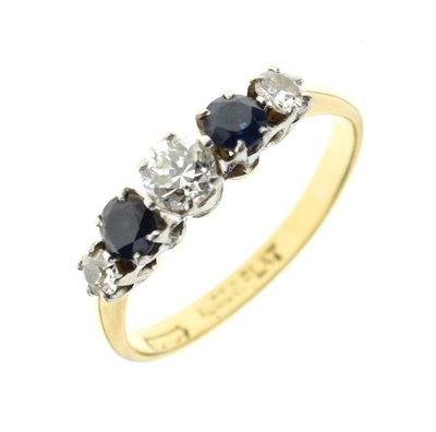 Lot 22 - Graduated five stone diamond and sapphire ring