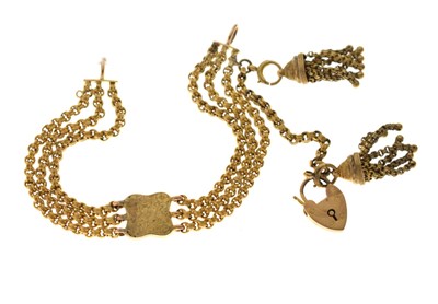Lot 149 - Victorian yellow metal bracelet with a heart-shaped padlock clasp and tassels
