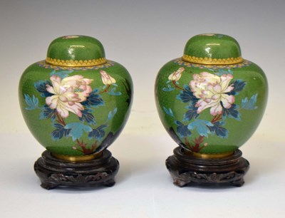 Lot 640 - Pair of mid to late 20th century green ground cloisonné ginger jars, covers and stands, boxed