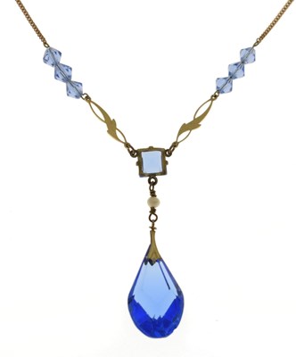 Lot 99 - Blue pendant on yellow metal chain