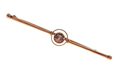 Lot 86 - Antique yellow metal bar brooch set a faceted round pale pink stone