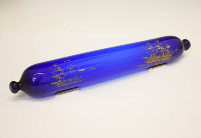 Lot 553 - Bristol Blue glass rolling pin with gilt ship decoration