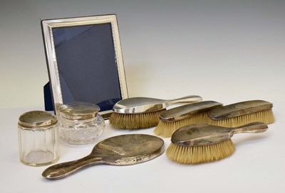 Lot 230 - Elizabeth II silver-mounted easel photograph frame, and a silver dressing table set, etc