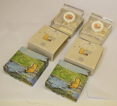 Lot 313 - Two Elizabeth II enamelled silver proof 50p coin celebrating Winnie The Pooh, 2020