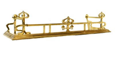 Lot 562 - Art Nouveau brass fire fender