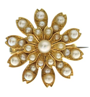 Lot 96 - Unmarked yellow metal and split pearl floral brooch