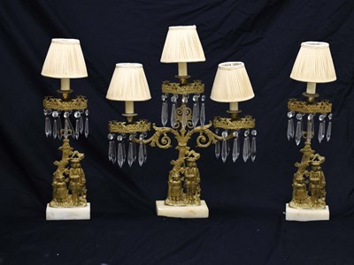 Lot 301 - Garniture of three brass and alabaster table lustres