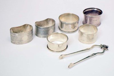 Lot 92 - Pair of Edward VII silver sugar nips, together with six assorted silver napkin rings