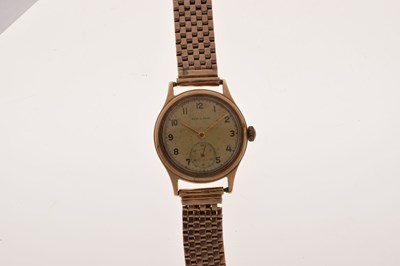 Lot Baume - 1950s 9ct gold cased bracelet watch