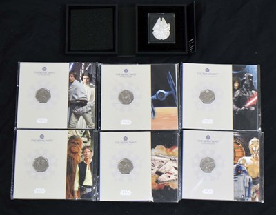 Lot 156 - Silver Millennium Falcon 2oz coin, and six Star Wars proof coin packs