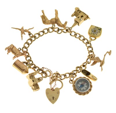 Lot 40 - 9ct gold curb link charm bracelet, attached various 9ct gold charms, etc