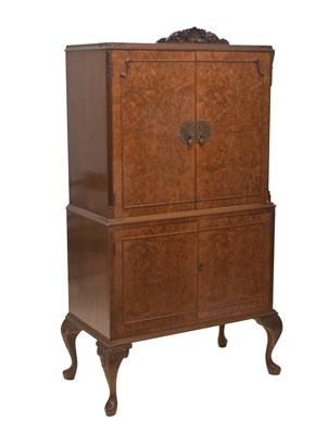 Lot 571 - Figured walnut cocktail cabinet