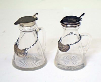 Lot 101 - Two silver mounted cut glass whisky noggins