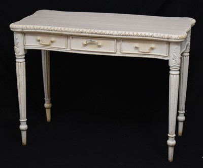 Lot 557 - French-style cream painted dressing table